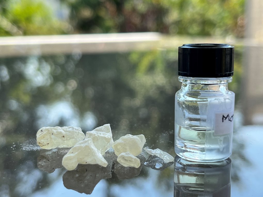 Dammar resin, an ingredient in embalming, next to a bottle of the ancient scent recreated by perfumer Carole Calvez based on scientific analyses